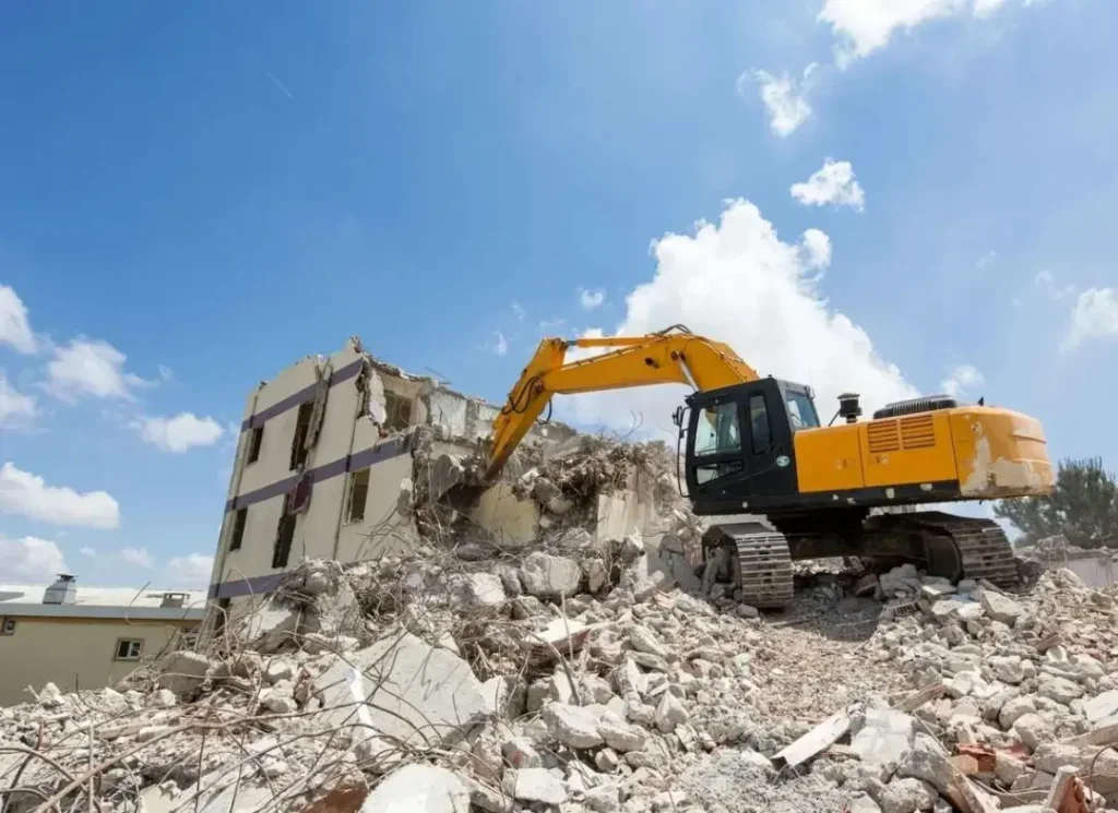Excavators crushing concrete