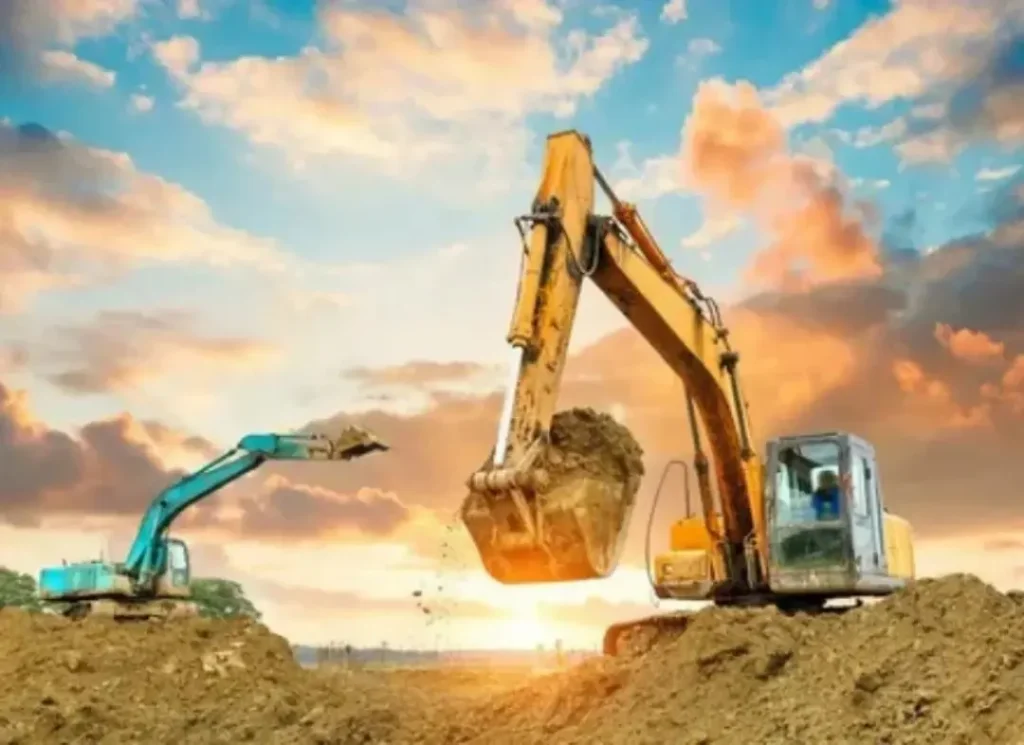Two excavators digging dirt