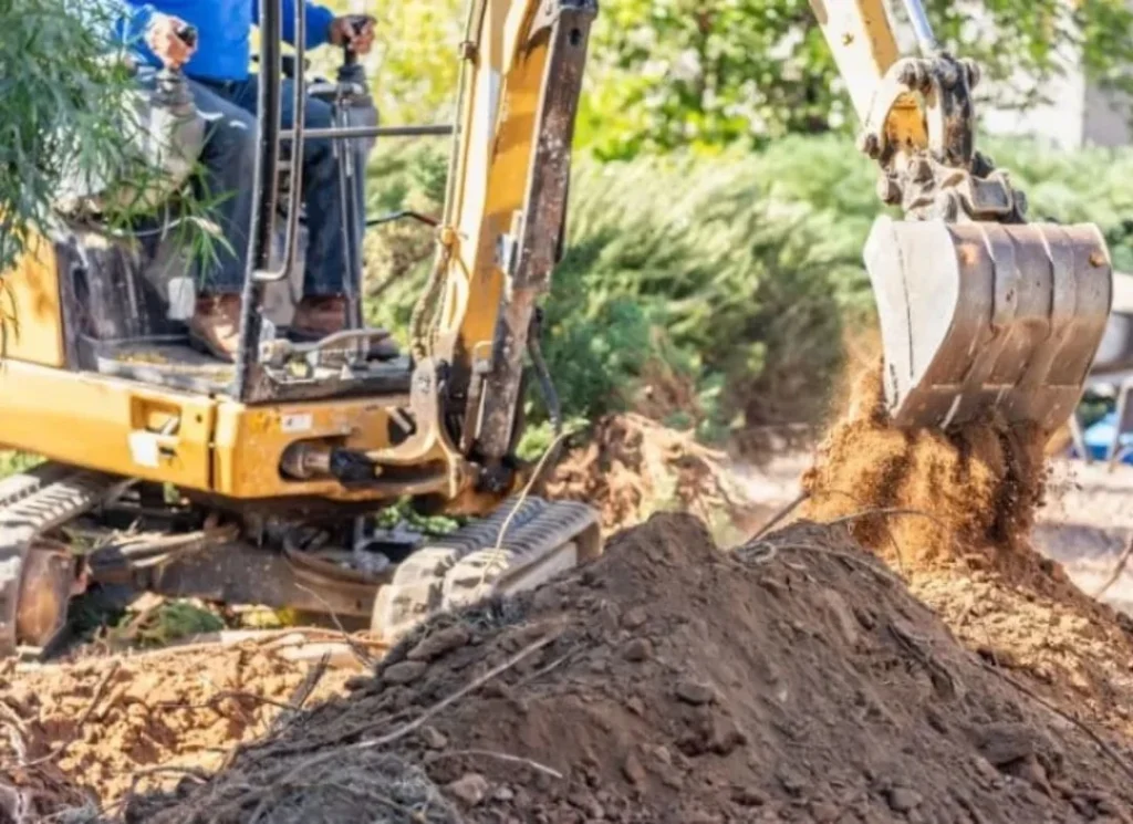 Excavator digging a trench