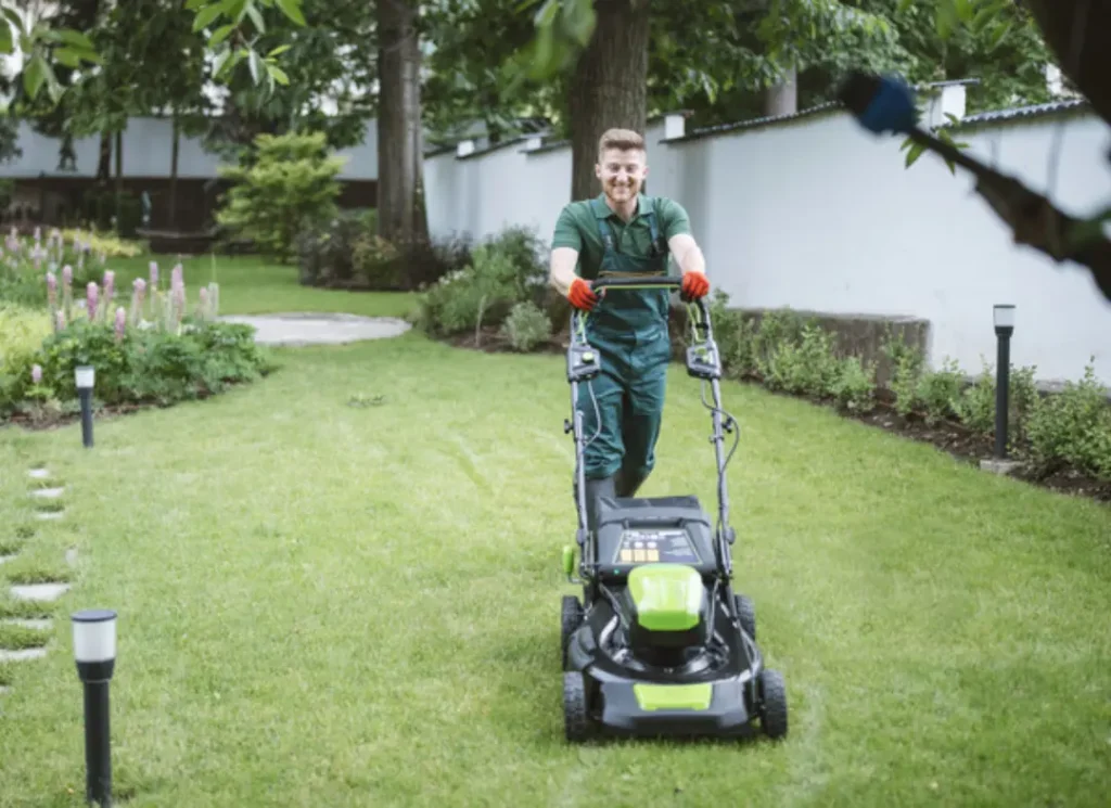 Person aerating a lawn.