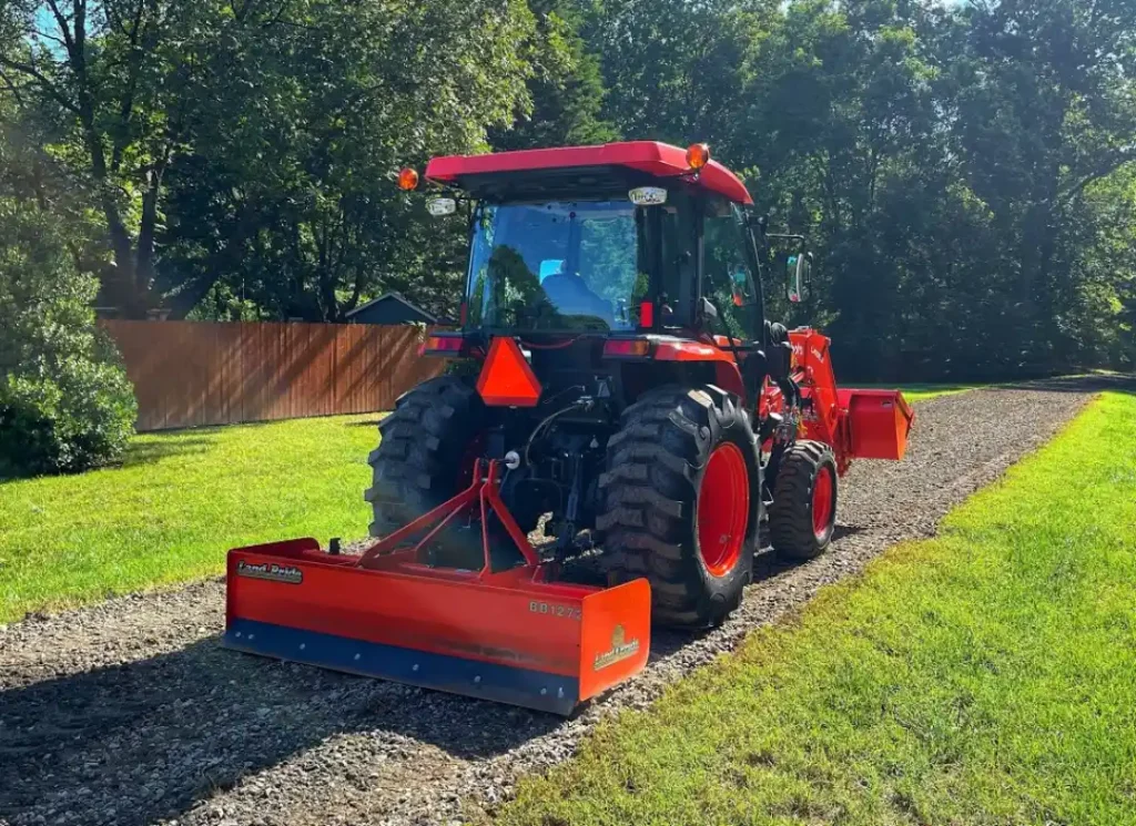 Tractor repairing gravel driveway.